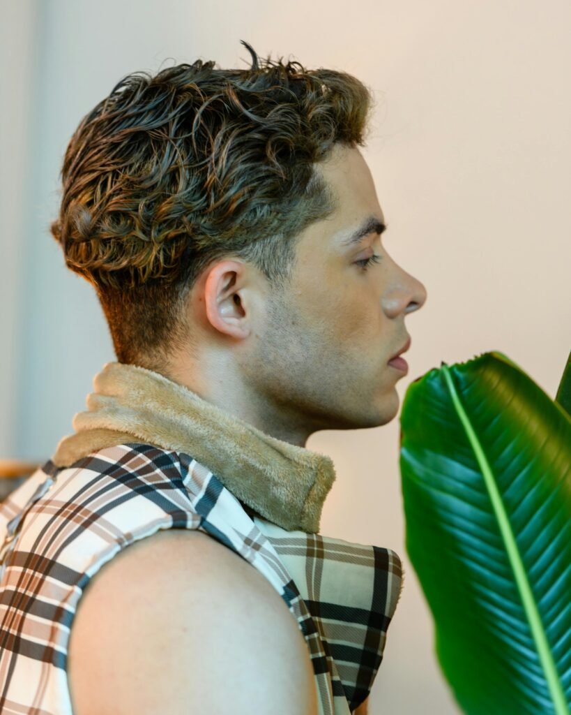 Profile portrait of a young man indoors in Sao Paulo, Brazil.